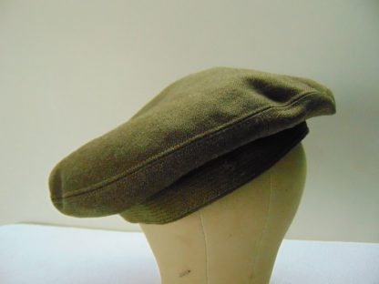 H122	 size (est.7 1/2+) front to back 7 5/8in. side to side 7 1/2in. Vintage Green Wool Beret possible some Army	$40