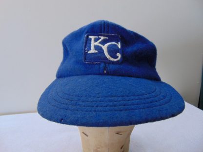 H140	 size (est.7 1/8 tight 7 1/4) Wool KC Royals 1960's Baseball vintage cap	$30 	 tiny hole, tiny 1 cm. split at seam, wool in good shape