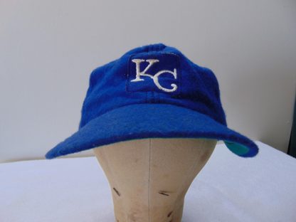 H141	 size (est.7 1/8 tight 7 1/4) Wool KC Royals 1960's Baseball vintage cap	$20 	wool have hole in bill, Megan written inside bill