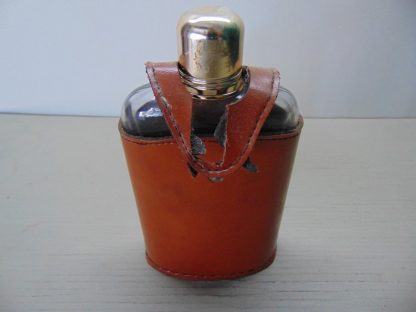 k126		Vintage Glass Liquor Flask and leather case	$10